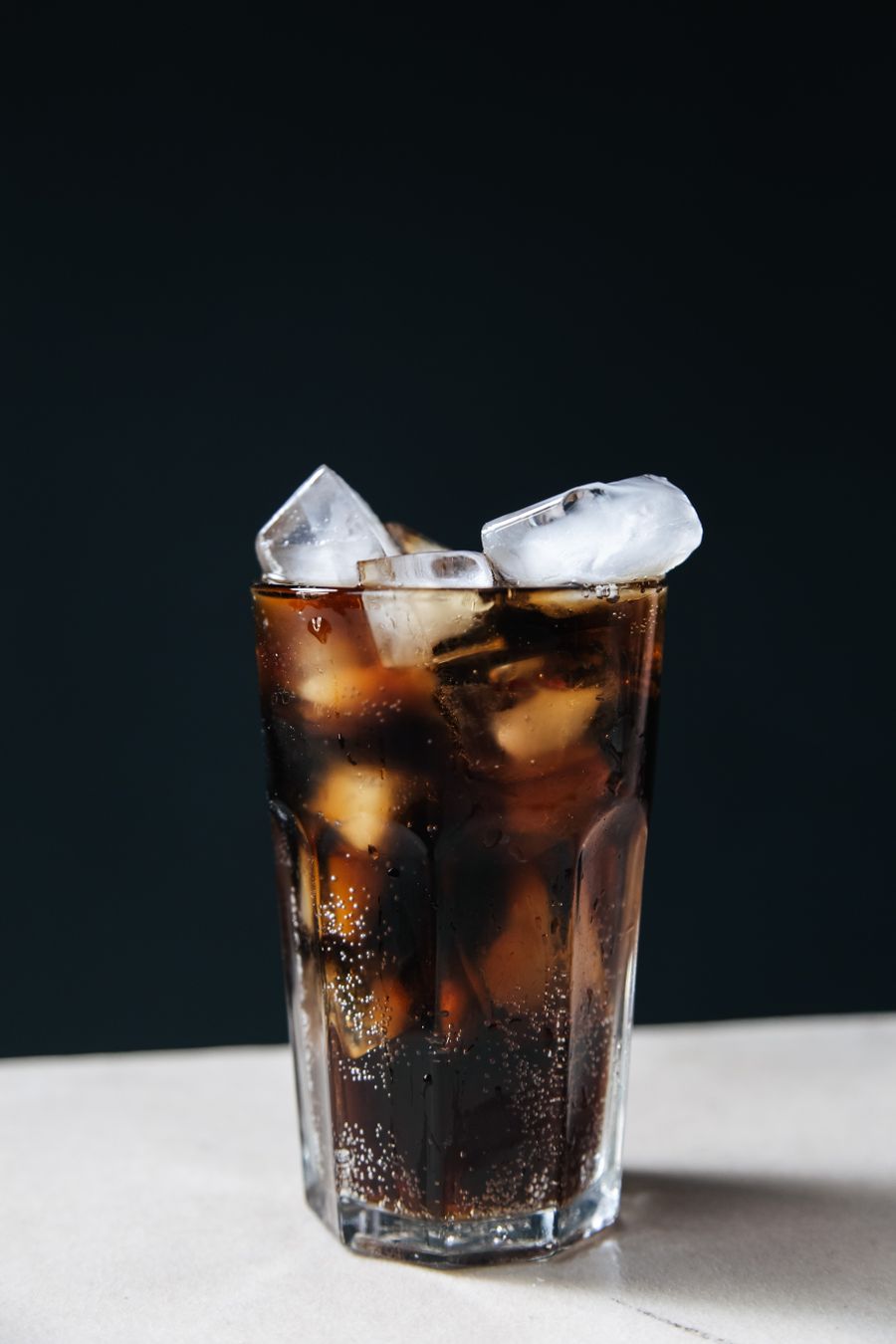 A glass of cola with ice